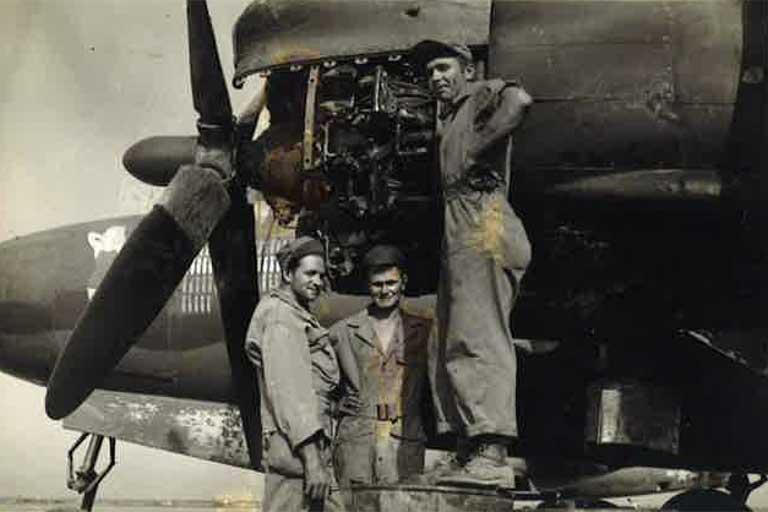 Barney working on a bomber